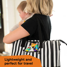 Musical take-along toy in a black-and-white striped travel bag with bead chaser