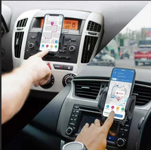 Car phone auto mount with black one-grip holder on dashboard, holding a smartphone