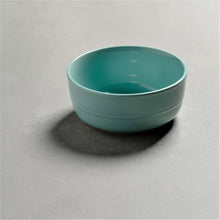 Seafoam green round ceramic cereal bowl with glossy interior