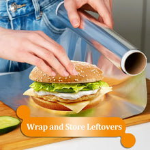 Aluminum foil sheet wrapping a sandwich on a cutting board