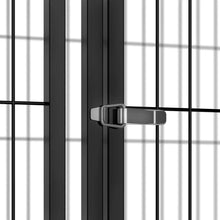 Black wire kennel door latch with sliding clasp on metal frame.