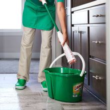 Green-handled microfiber mop with rotating cloth head during cleaning