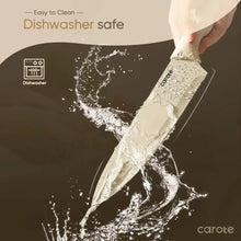 Chef knife with ceramic coating shown being washed, with water splash around the blade.