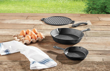 Cast iron skillet set with ridged griddle and two skillets, pre-seasoned dark finish