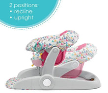 Adjustable baby floor seat with geometric cover, pink insert, and upright frame
