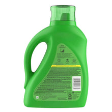 Back view of green liquid laundry detergent bottle with barcode and ingredient panel