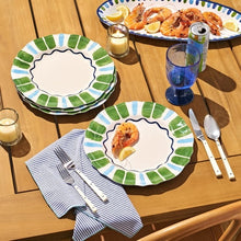 4-piece dinner plate set on table, white centers with green and blue scalloped pattern
