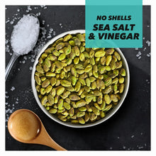 No-shell sea salt & vinegar pistachios in white bowl with wooden scoop