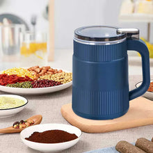 Blue electric coffee grinder with stainless interior and side handle on a table