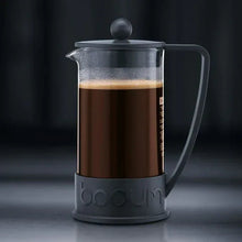 Black French press coffee maker with glass carafe and piston lid