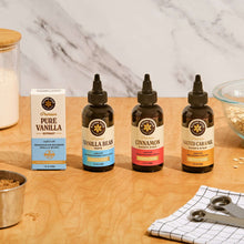 Vanilla extract bottle assortment with amber droppers and label fronts