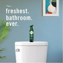 Febreze air mist aerosol bottle with green nozzle on white toilet tank