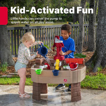 Kids play pump-and-splash water table with red pump and blue and yellow parts.