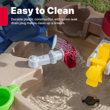 Pump and Splash water table tray with water splashing from a red pump spout.