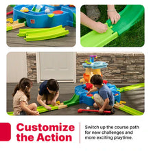 Blue and green toy water play center with removable slide pieces and water channels