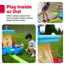 Toy water play center with blue top and green rails, indoor/outdoor play setup