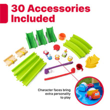 Water play accessory set with green ramps, red launcher, balls, and small characters