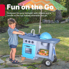 Blue children’s BBQ play cart with umbrella and open grill area, toy food inside