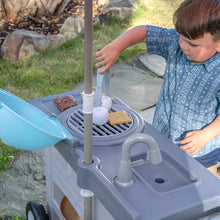 Blue BBQ play cart top with umbrella pole and grill opening, toy accessories visible