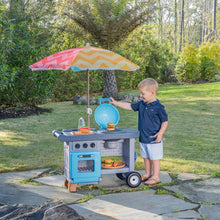 Blue children’s BBQ play cart with colorful umbrella and toy grill, on wheels