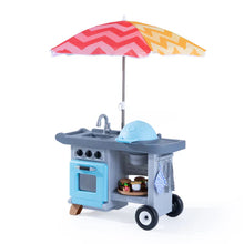Blue children’s BBQ play cart with umbrella, wheels, and side towel, front knobs