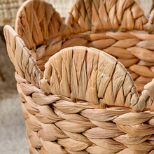 Woven water hyacinth basket rim detail, scalloped tan weave and braided edge