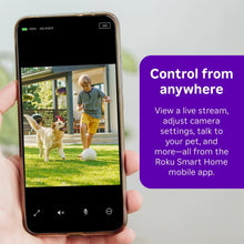 Handheld smartphone displaying live view from an outdoor security camera
