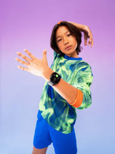Kids LTE smartwatch on a child’s wrist with gray watch screen and mesh strap