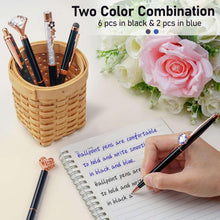 Black and blue fancy ballpoint pens with rose-gold accents for journaling