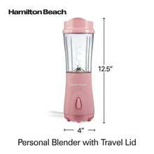 Coral personal blender with clear jar, pink base, and travel lid