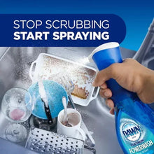 Dish soap spray bottle in hand spraying soiled sinkware with suds and foam