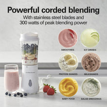 White personal blender with blending jar and travel jar, with assorted smoothie cups
