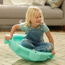 Teal turtle rocking disk with smooth rounded seat and side openings