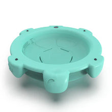 Mint green turtle rocking disk with raised edge and four molded feet