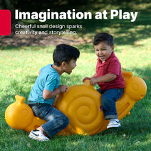 Orange snail seesaw toy in grass with two children seated and playing