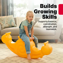 Orange snail seesaw toy with child standing and gripping the side handles
