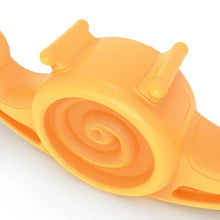 Side view of orange snail seesaw toy with spiral shell and curved base