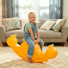 Orange snail seesaw toy with a child standing barefoot on the seat