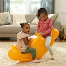 Orange snail seesaw toy with two children playing together on the seat