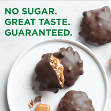 Sugar-free dark chocolate pecan candy pieces with caramel filling in a white dish