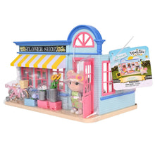Flower shop dollhouse playset in box with pink door, window display, and bear figure