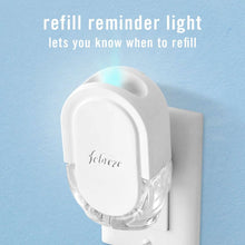 White Febreze plug-in air freshener oil refill showing refill reminder light window