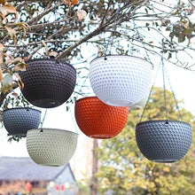Assorted self-watering hanging planters with chain hangers, textured hex pattern, mixed colors