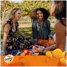 Goldfish Flavor Blasted snack packs on outdoor table with cheddar crackers