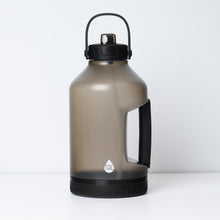 Metallic plastic gallon jug water bottle with black flip-up straw and textured grip