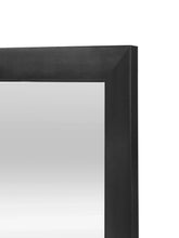 Black mirror frame corner detail with smooth matte finish.