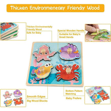 Wooden peg puzzle board with sea animal shapes and smooth wooden pieces