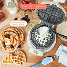 Rotating Belgian waffle maker by Drew Barrymore, open dark plates with batter scoop