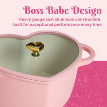Pink heart-shaped Dutch oven lid rim with gold heart knob