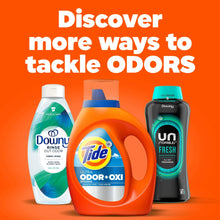 Tide Ultra Odor+Oxi orange detergent bottle with blue cap alongside other detergent bottles